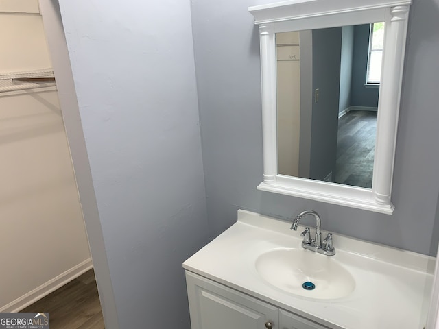 3261 Harbor Woods Rd, Decatur, GA 30034 - bathroom featuring vanity, baseboards, and wood finished floors
