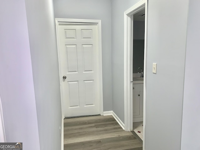 3261 Harbor Woods Rd, Decatur, GA 30034 - corridor with wood finished floors, a sink, and baseboards