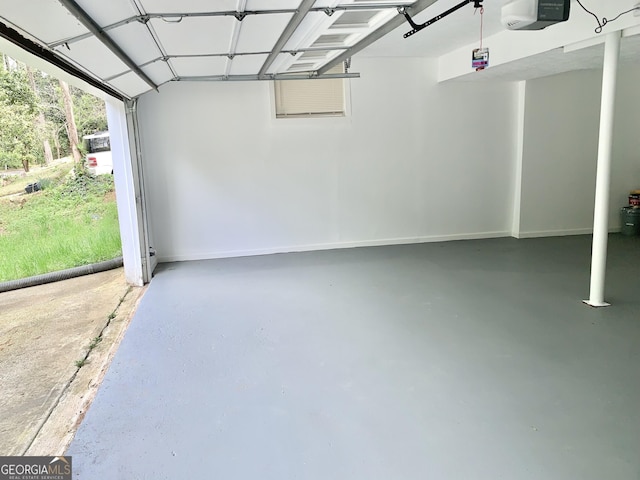 3261 Harbor Woods Rd, Decatur, GA 30034 - garage featuring baseboards and a garage door opener