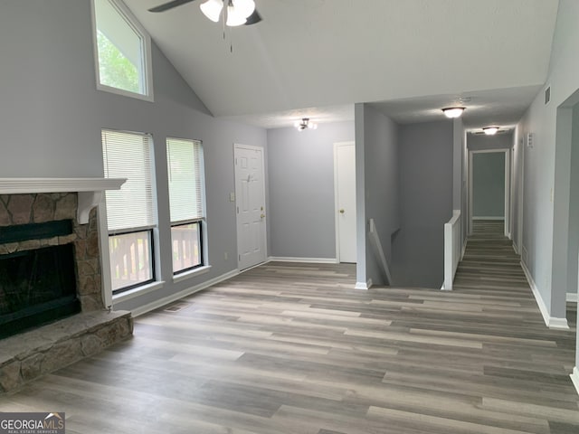 3261 Harbor Woods Rd, Decatur, GA 30034 - unfurnished living room with baseboards, a fireplace, a ceiling fan, visible vents, and wood finished floors
