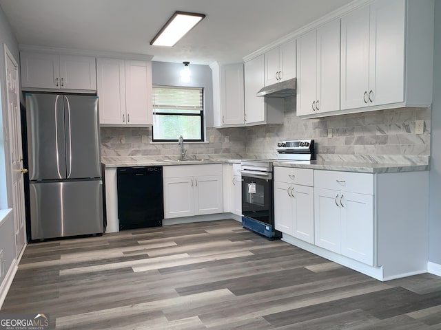 3261 Harbor Woods Rd, Decatur, GA 30034 - kitchen with tasteful backsplash, white cabinets, a sink, appliances with stainless steel finishes, and under cabinet range hood