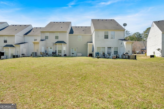 7112 Brookview Way, Riverdale, GA 30274 - rear view of property featuring a yard and central AC