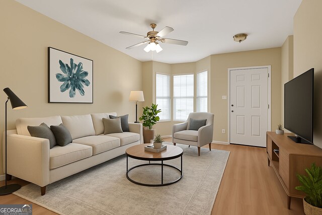 7112 Brookview Way, Riverdale, GA 30274 - living area with ceiling fan, light wood finished floors, and baseboards