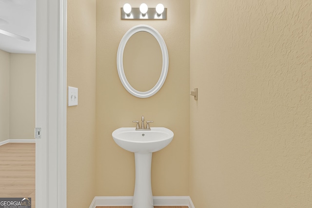 7112 Brookview Way, Riverdale, GA 30274 - bathroom with wood finished floors and baseboards