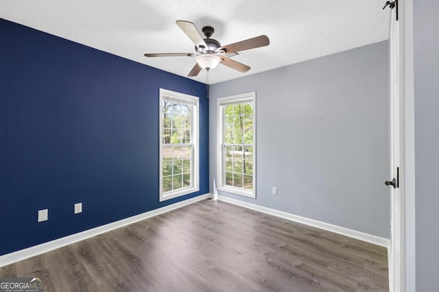 348 Bluegill Rd, Eatonton, GA 31024 - empty room with a ceiling fan, wood finished floors, and a textured ceiling