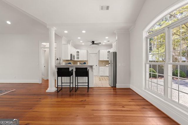 2091 Juliention Dr NE, Townsend, GA 31331 - kitchen featuring tasteful backsplash, a peninsula, a ceiling fan, visible vents, and appliances with stainless steel finishes