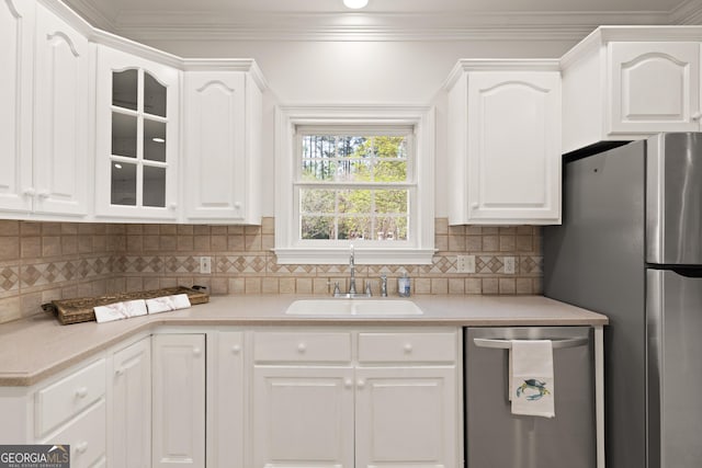 2091 Juliention Dr NE, Townsend, GA 31331 - kitchen with stainless steel appliances, light countertops, white cabinetry, and a sink
