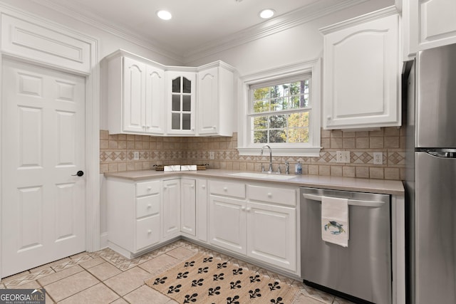 2091 Juliention Dr NE, Townsend, GA 31331 - kitchen with white cabinets, light countertops, a sink, and appliances with stainless steel finishes