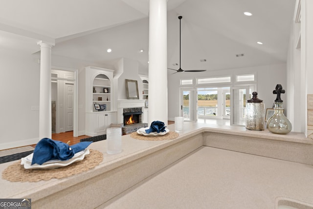 2091 Juliention Dr NE, Townsend, GA 31331 - interior space featuring open floor plan, a ceiling fan, decorative columns, a fireplace, and recessed lighting