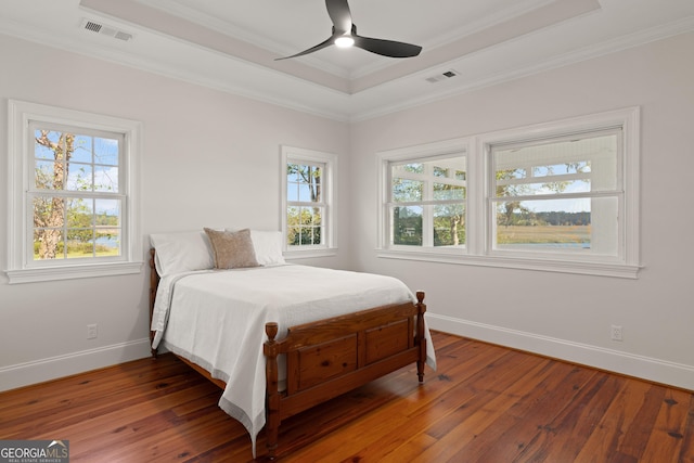2091 Juliention Dr NE, Townsend, GA 31331 - bedroom featuring visible vents, hardwood / wood-style flooring, baseboards, and a raised ceiling