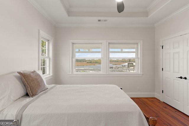 2091 Juliention Dr NE, Townsend, GA 31331 - bedroom with a tray ceiling, wood finished floors, ornamental molding, and visible vents