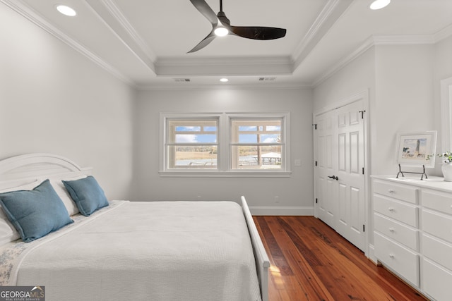 2091 Juliention Dr NE, Townsend, GA 31331 - bedroom featuring a raised ceiling, dark wood-type flooring, crown molding, and recessed lighting