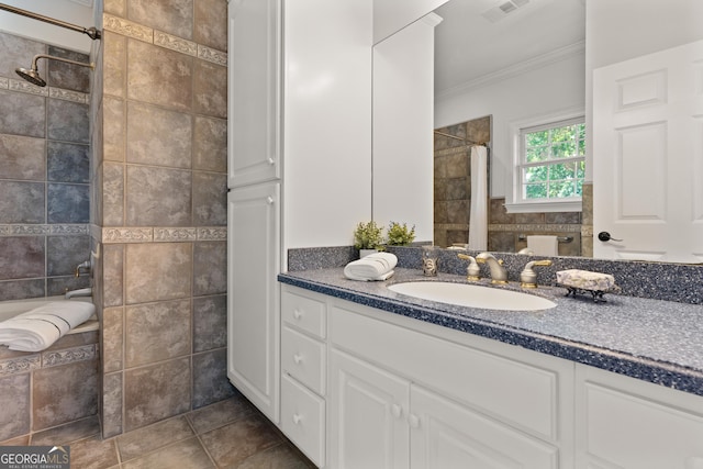 2091 Juliention Dr NE, Townsend, GA 31331 - full bathroom featuring vanity, ornamental molding, tile patterned floors, visible vents, and a tile shower