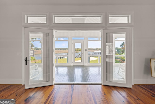 2091 Juliention Dr NE, Townsend, GA 31331 - doorway to outside featuring baseboards and hardwood / wood-style flooring