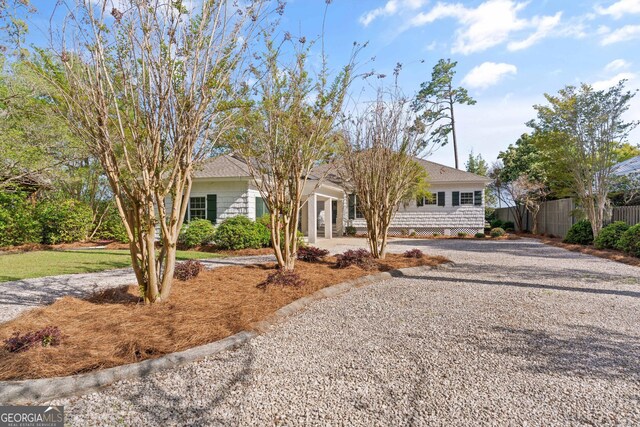 2091 Juliention Dr NE, Townsend, GA 31331 - ranch-style home with driveway and fence