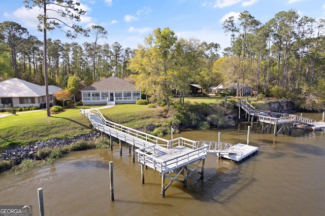 2091 Juliention Dr NE, Townsend, GA 31331 - dock area featuring a water view and a yard