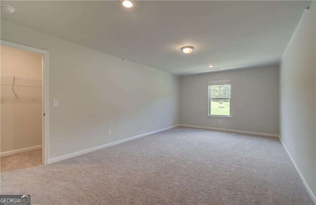 140 Cooper Cv E Lot 21, Fayetteville, GA 30215 - spare room featuring light carpet and recessed lighting