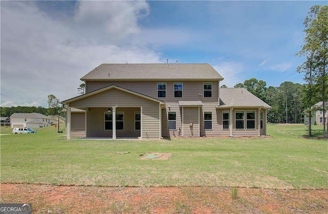 140 Cooper Cv E Lot 21, Fayetteville, GA 30215 - rear view of house with a yard