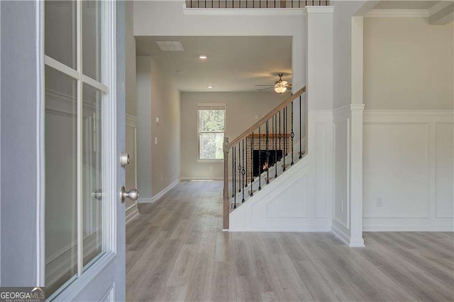 140 Cooper Cv E Lot 21, Fayetteville, GA 30215 - entryway with stairs, a ceiling fan, wood finished floors, and a decorative wall