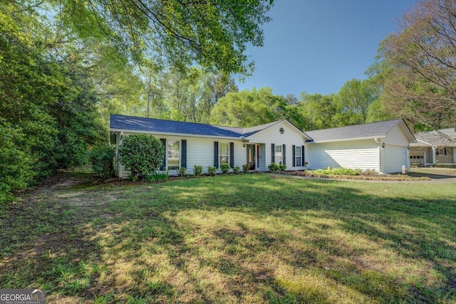 single story home featuring a front lawn and a garage