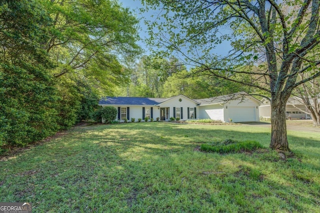 single story home with a garage and a front yard