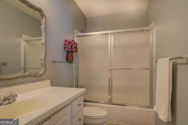 full bath with toilet, vanity, enclosed tub / shower combo, and a textured ceiling
