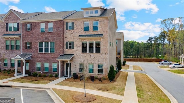 view of front of home featuring brick siding