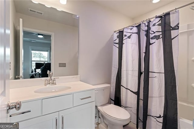bathroom with vanity, visible vents, and toilet