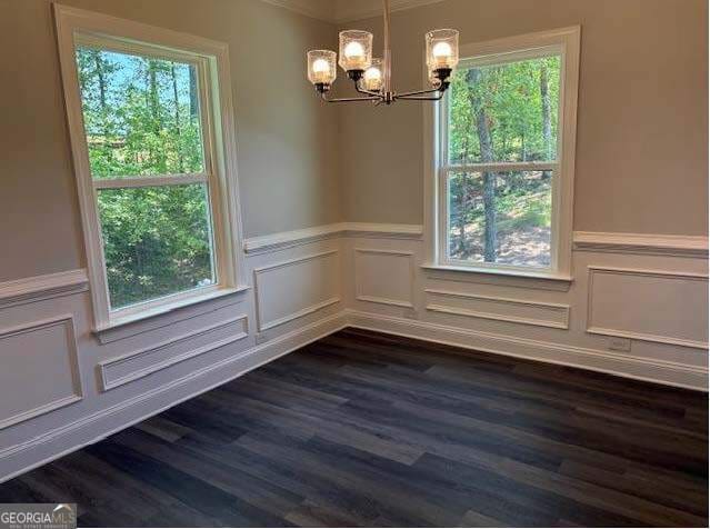3383 Milan Court Lot 4; Plapprox Sqft 1, Douglasville, GA 30135 - unfurnished room with a chandelier, wainscoting, dark wood-style floors, and a decorative wall