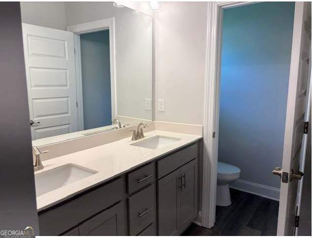 3383 Milan Court Lot 4; Plapprox Sqft 1, Douglasville, GA 30135 - full bath featuring toilet, double vanity, wood finished floors, and baseboards