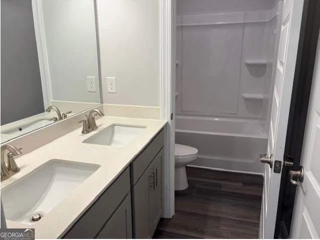 3383 Milan Court Lot 4; Plapprox Sqft 1, Douglasville, GA 30135 - full bathroom featuring double vanity, toilet, wood finished floors, and shower / bath combination