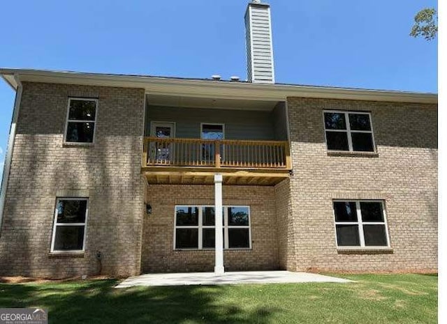 3383 Milan Court Lot 4; Plapprox Sqft 1, Douglasville, GA 30135 - back of house featuring a balcony, a chimney, a patio area, and a lawn