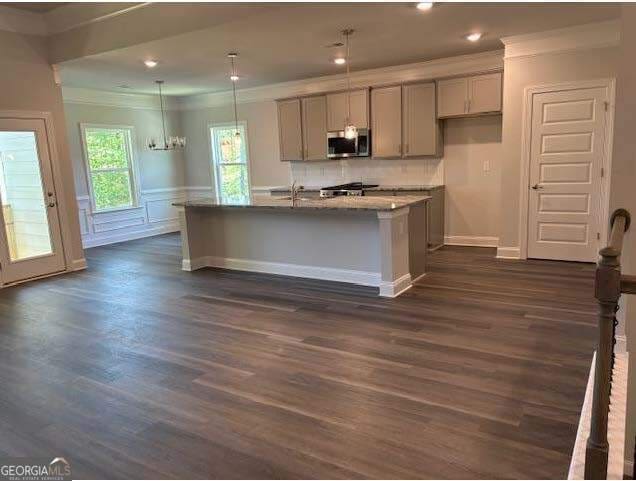 3383 Milan Court Lot 4; Plapprox Sqft 1, Douglasville, GA 30135 - kitchen with stainless steel microwave, ornamental molding, gray cabinets, dark wood-style flooring, and an island with sink