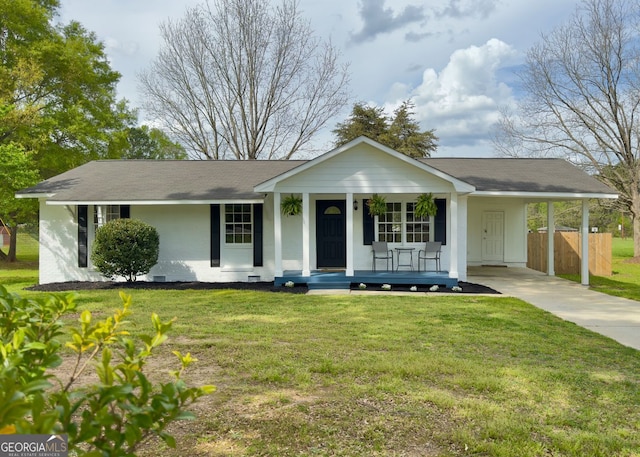 single story home with covered porch, fence, a front lawn, concrete driveway, and an attached carport