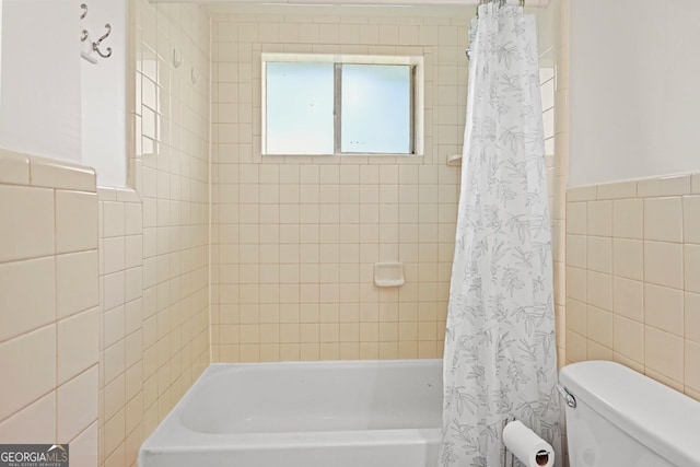 262 E Main St, Rutledge, GA 30663 - full bathroom featuring a wainscoted wall, tile walls, toilet, and shower / bath combination with curtain