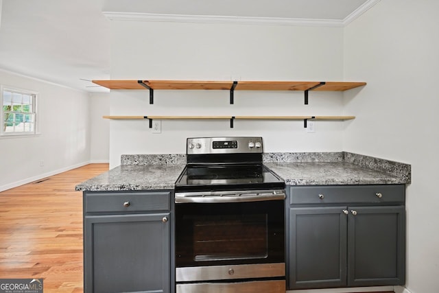 262 E Main St, Rutledge, GA 30663 - kitchen with open shelves, crown molding, gray cabinets, and electric range