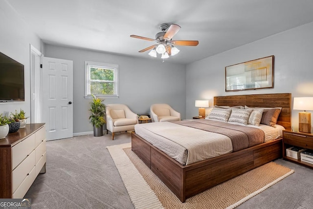 bedroom with carpet floors, a ceiling fan, and baseboards