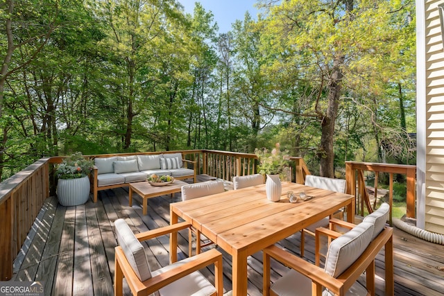wooden terrace featuring an outdoor hangout area