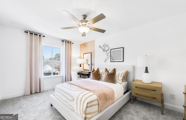 bedroom with carpet, baseboards, and ceiling fan