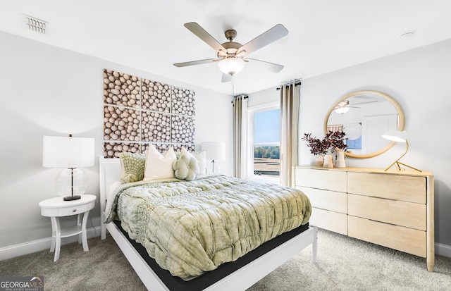 bedroom with light carpet, baseboards, a ceiling fan, and visible vents