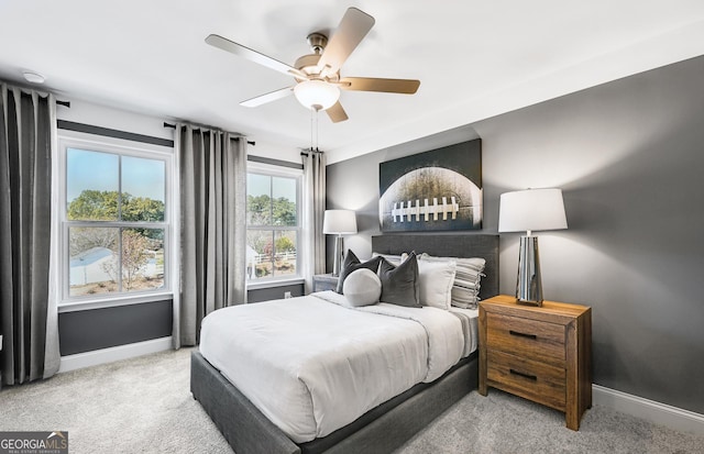 bedroom featuring carpet floors, baseboards, and a ceiling fan