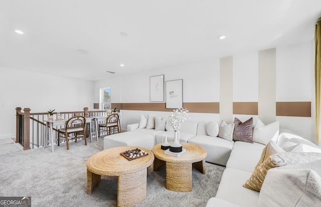 living area featuring recessed lighting and carpet