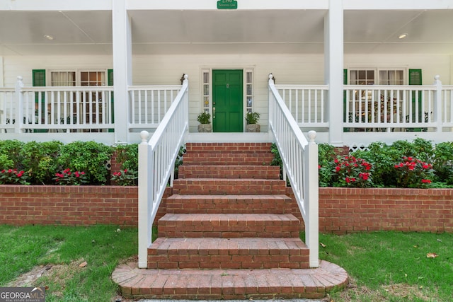 doorway to property with a porch