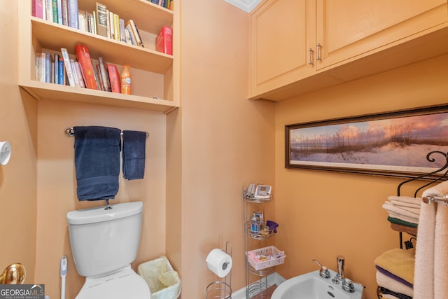 bathroom featuring toilet and a bidet