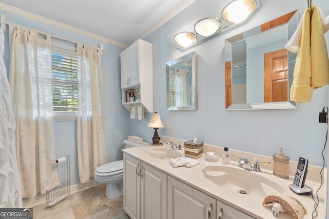 bathroom with toilet, crown molding, and double vanity