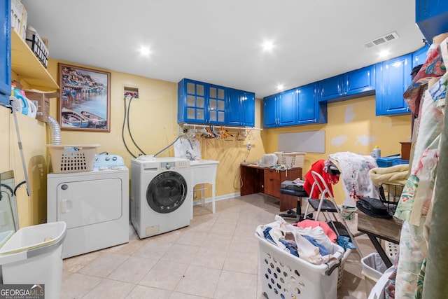 laundry room featuring light tile patterned flooring, washing machine and clothes dryer, and recessed lighting