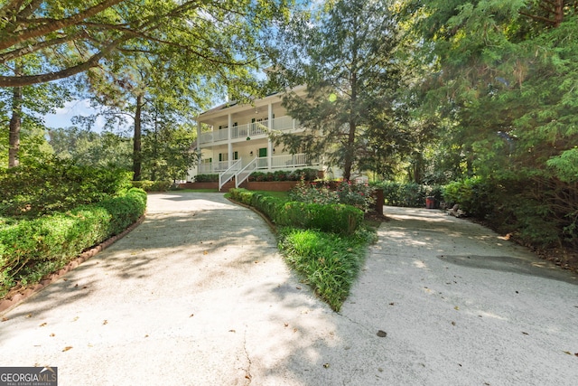 view of property's community featuring stairway