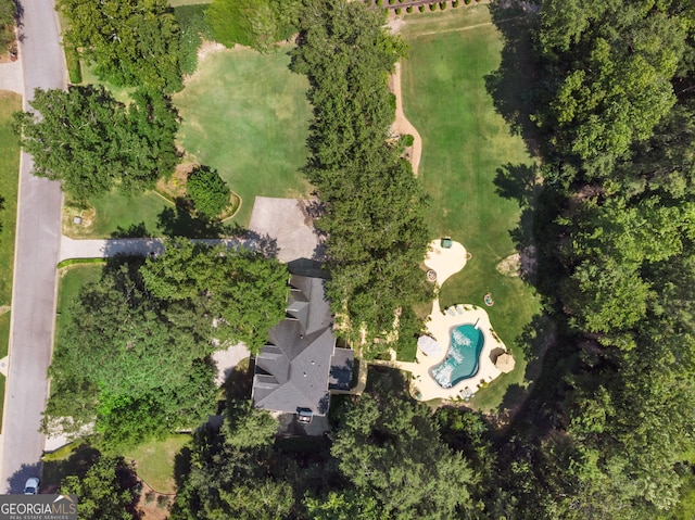 view of property location featuring a pool area