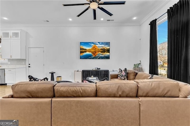 living room with crown molding, a ceiling fan, wood finished floors, and recessed lighting