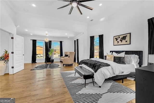 bedroom featuring recessed lighting, light wood-type flooring, and ornamental molding